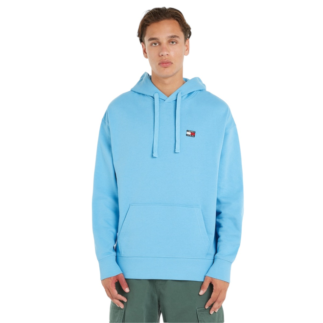 TOMMY HILFIGER BLUZA MĘSKA Z KAPTUREM TJM RLX XS BADGE HOODIE NIEBIESKA DM0DM16369 CY7